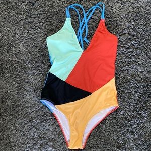One piece swim suit. New never worn